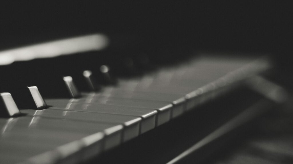 Artistic black and white close-up of piano keys with soft focus and minimalistic style.